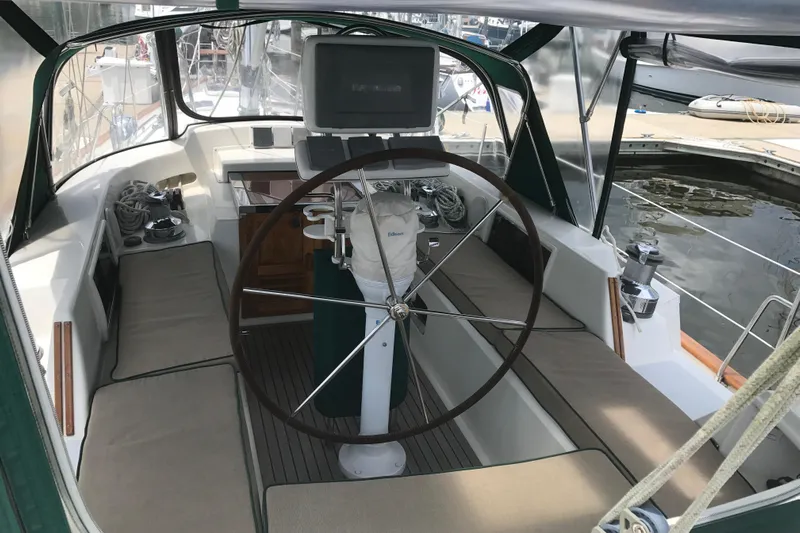 Wild Spirit Yacht Photos Pics Cockpit of a 1999 Passport 456 sailboat with steering wheel and navigation equipment.