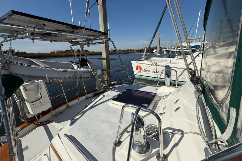 Wild Spirit Yacht Photos Pics Sailboat docked at marina, featuring Passport 456 model, sunny day, clear blue sky.