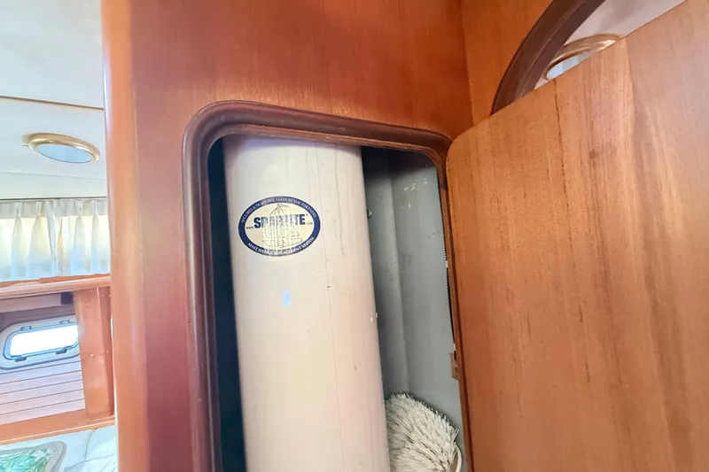 Wild Spirit Yacht Photos Pics Wooden interior of a 1999 Passport 456 yacht with storage compartment.