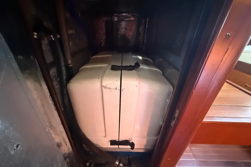 Wild Spirit Yacht Photos Pics Engine compartment of a 1999 Passport 456 yacht, featuring a white engine cover.