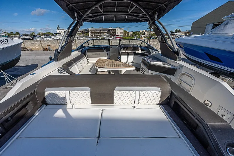  Yacht Photos Pics 2017 Sea Ray SLX 310 OB boat with spacious seating and table.