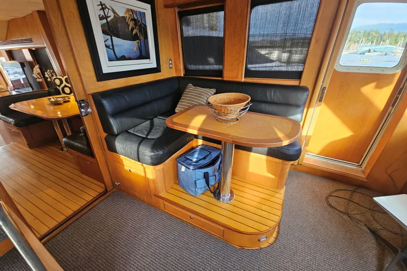 Katula Yacht Photos Pics Luxurious 2003 Mikelson Long Range Cockpit MY interior with leather seating and wooden accents.