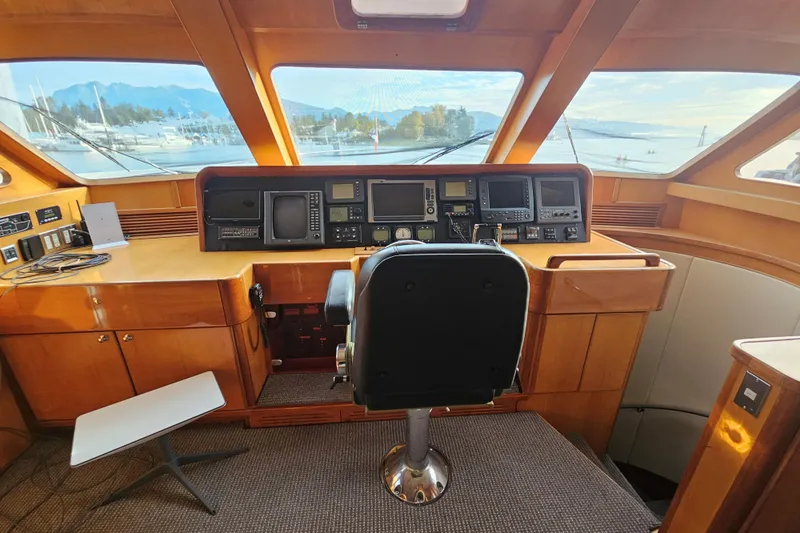 Katula Yacht Photos Pics Cockpit of 2003 Mikelson Long Range Cockpit MY yacht with navigation equipment and panoramic windows.