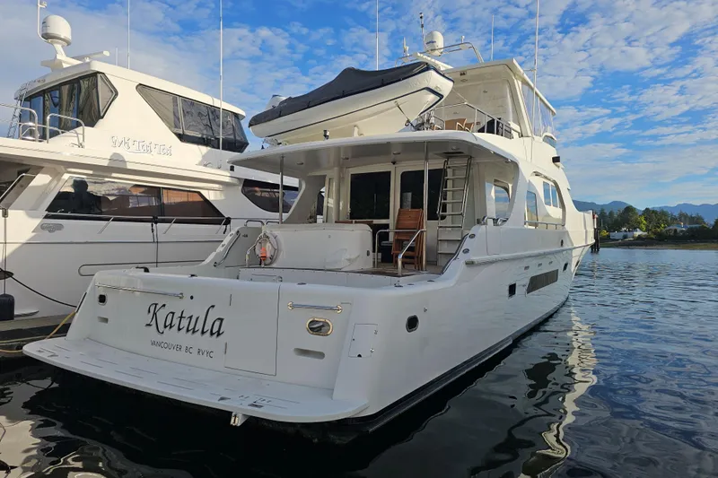Katula Yacht Photos Pics 2003 Mikelson Long Range Cockpit MY yacht docked, featuring sleek design and spacious deck.