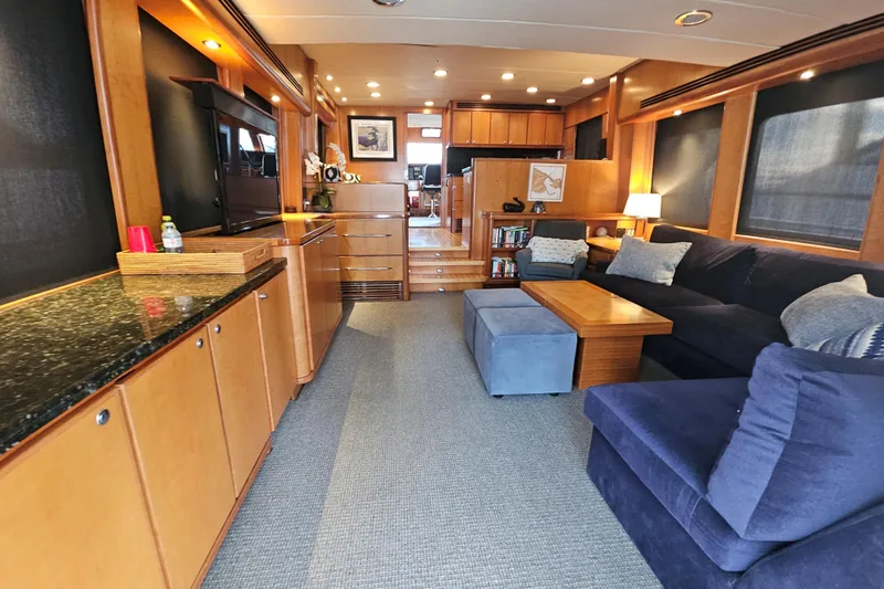 Katula Yacht Photos Pics Luxurious interior of 2003 Mikelson Long Range Cockpit MY yacht with cozy seating and elegant decor.