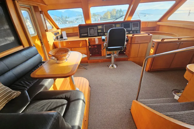 Katula Yacht Photos Pics Luxurious 2003 Mikelson Long Range Cockpit MY yacht interior with helm and seating area.