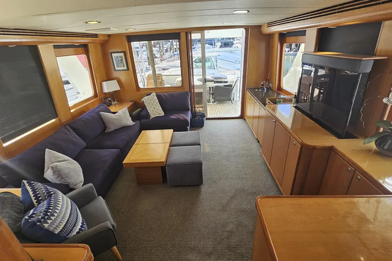 Katula Yacht Photos Pics Luxurious interior of 2003 Mikelson Long Range Cockpit MY yacht with plush seating and elegant decor.