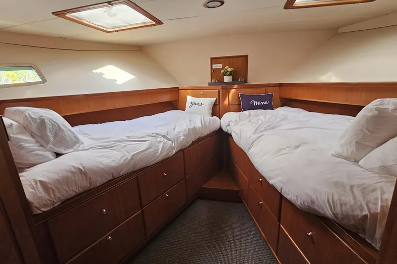 Katula Yacht Photos Pics Luxurious cabin interior of 2003 Mikelson Long Range Cockpit MY yacht with twin beds.