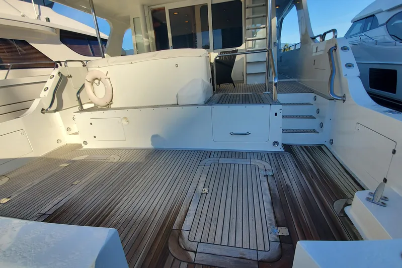 Katula Yacht Photos Pics 2003 Mikelson Long Range Cockpit MY yacht with spacious deck and elegant wood finish.