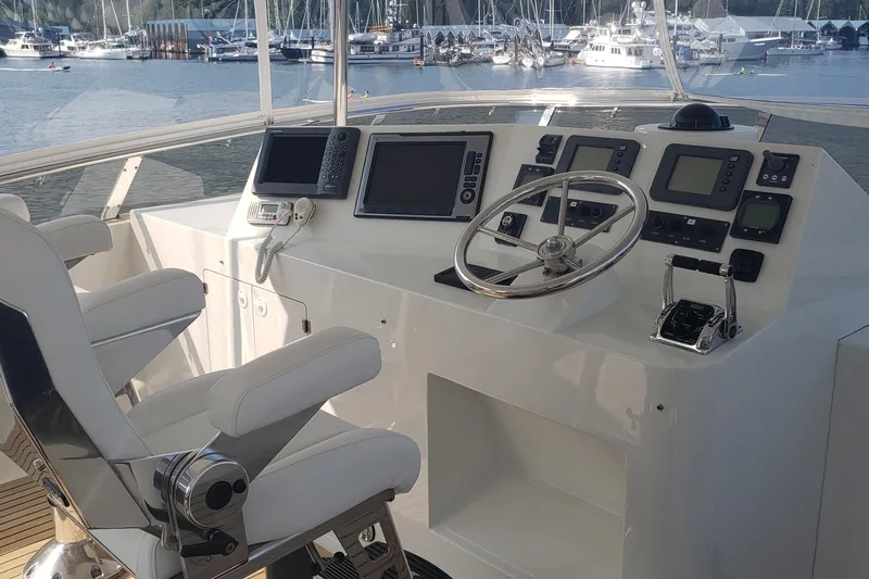 Katula Yacht Photos Pics 2003 Mikelson Long Range Cockpit MY yacht helm with navigation equipment and marina view.