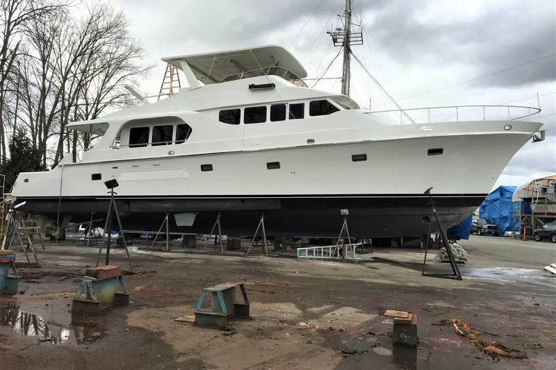 Katula Yacht Photos Pics 2003 Mikelson Long Range Cockpit MY yacht on dry dock, overcast sky.