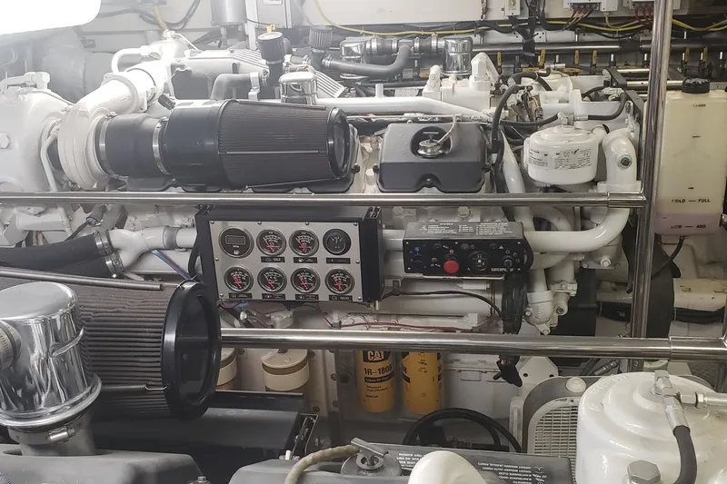 Katula Yacht Photos Pics Engine room of a 2003 Mikelson Long Range Cockpit MY with control panel and gauges.