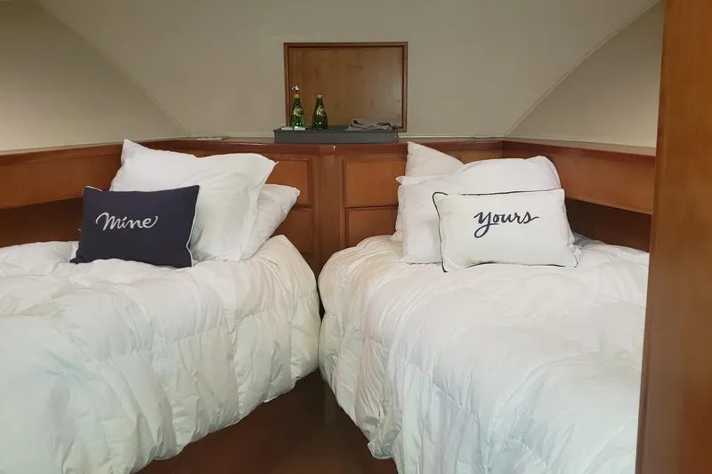 Katula Yacht Photos Pics Cozy twin beds in 2003 Mikelson Long Range Cockpit MY yacht cabin.