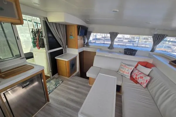 Tetelestai Yacht Photos Pics Interior of 2011 Lagoon 400 catamaran with modern seating and decor.