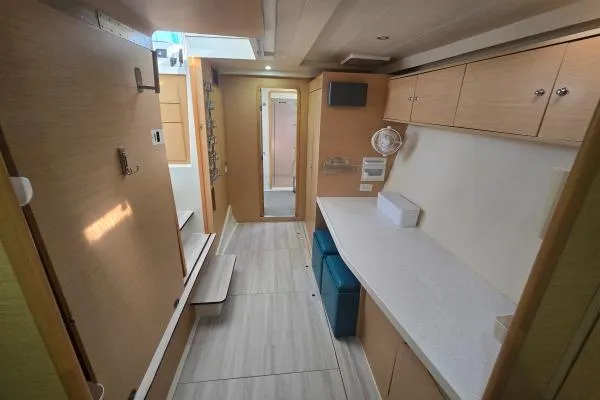 Tetelestai Yacht Photos Pics Interior of 2011 Lagoon 400 catamaran with modern wood cabinetry and sleek design.