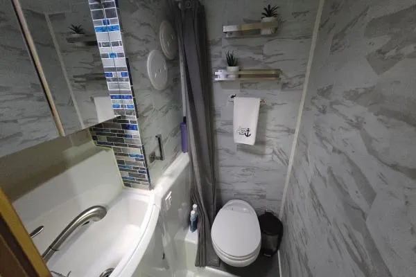 Tetelestai Yacht Photos Pics Compact bathroom in 2011 Lagoon 400 yacht with modern fixtures and decorative tiles.