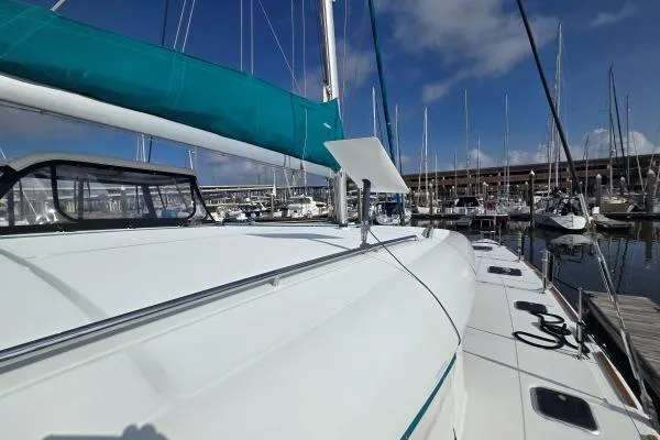 Tetelestai Yacht Photos Pics 2011 Lagoon 400 catamaran docked at a marina under a clear blue sky.