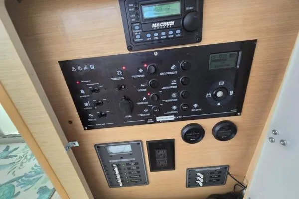 Tetelestai Yacht Photos Pics Control panel of a 2011 Lagoon 400 catamaran with various switches and displays.