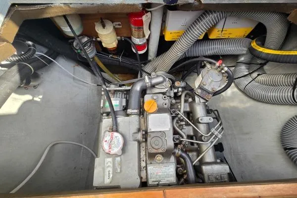 Tetelestai Yacht Photos Pics Engine compartment of a 2011 Lagoon 400 catamaran, featuring mechanical components and wiring.