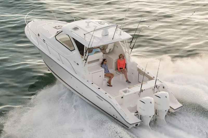  Yacht Photos Pics Manufacturer Provided Image: 2016 Pursuit OS 355 Offshore boat cruising on water with passengers.