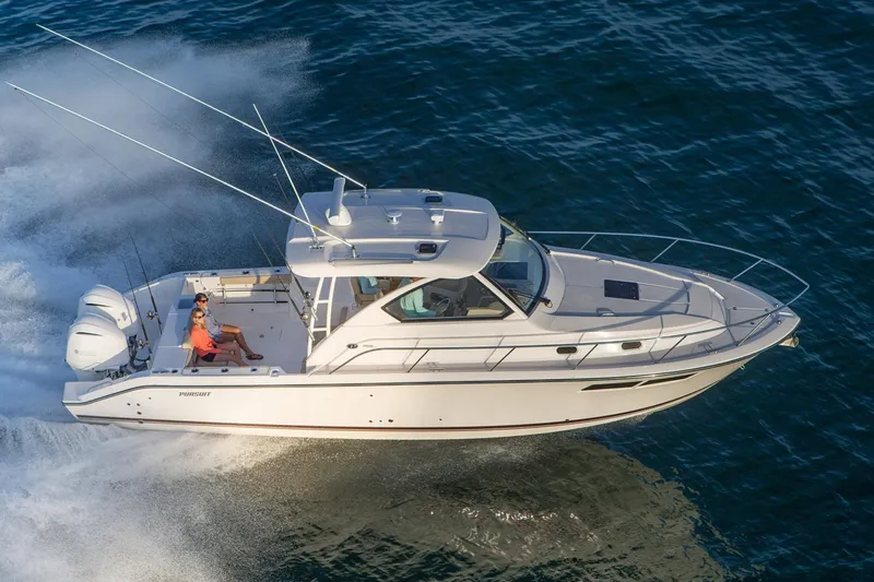  Yacht Photos Pics Manufacturer Provided Image: 2016 Pursuit OS 355 Offshore boat cruising on open water.