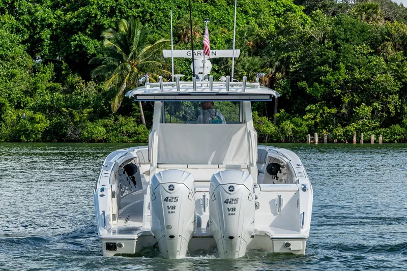 Island Girl II Yacht Photos Pics 2023 Pursuit S 358 Sport boat with twin engines on a scenic waterway.