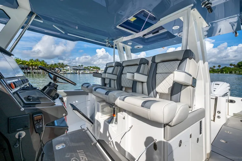 Island Girl II Yacht Photos Pics 2023 Pursuit S 358 Sport boat interior with luxurious seating and modern dashboard.