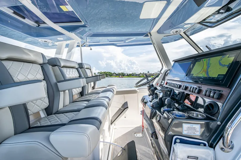 Island Girl II Yacht Photos Pics 2023 Pursuit S 358 Sport boat interior with luxury seating and advanced navigation system.