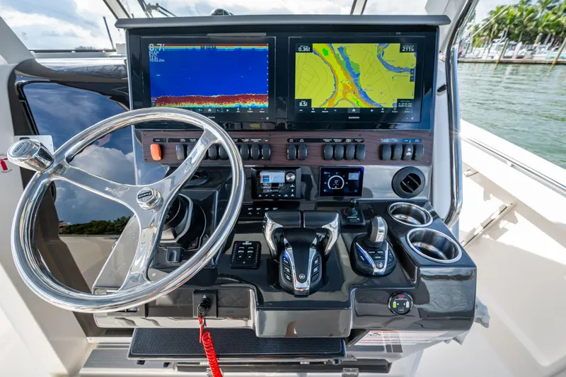 Island Girl II Yacht Photos Pics 2023 Pursuit S 358 Sport boat dashboard with advanced navigation displays and controls.