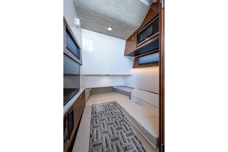 Island Girl II Yacht Photos Pics 2023 Pursuit S 358 Sport cabin interior with modern design and comfortable seating.