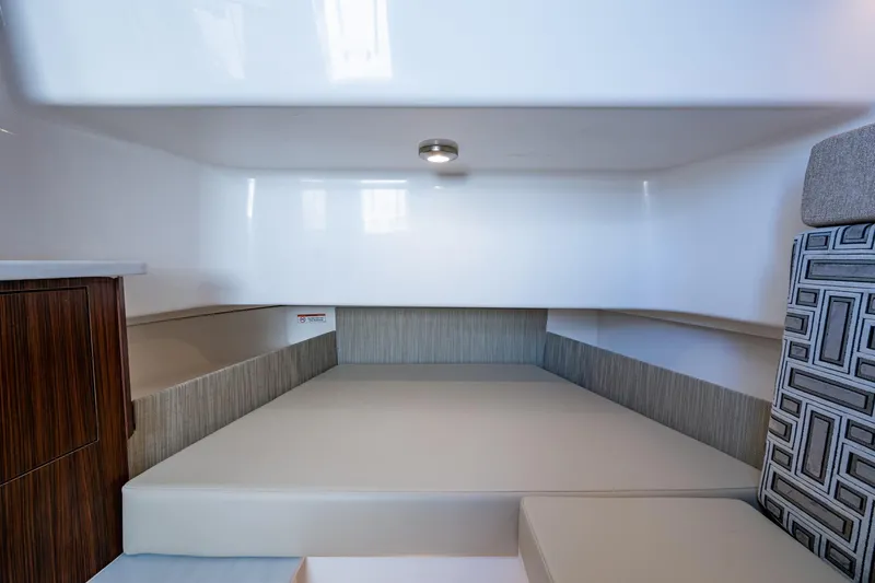 Island Girl II Yacht Photos Pics 2023 Pursuit S 358 Sport cabin interior with modern design and comfortable seating.