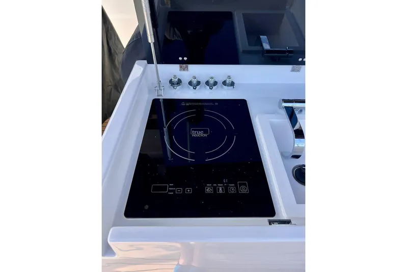  Yacht Photos Pics 2023 Tesoro T38 yacht kitchen with induction cooktop and modern sink.