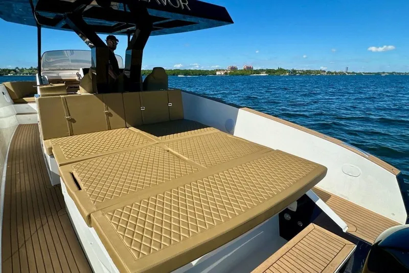  Yacht Photos Pics 2023 Tesoro T38 luxury boat with spacious sun deck on open water.