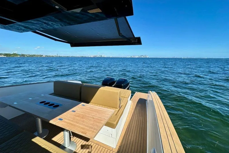  Yacht Photos Pics Luxurious 2023 Tesoro T38 yacht with spacious deck overlooking serene ocean view.