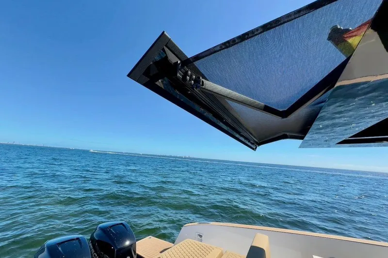  Yacht Photos Pics 2023 Tesoro T38 boat with sunshade, ocean view, and dual engines.