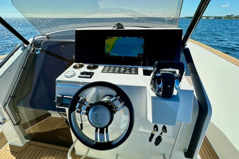  Yacht Photos Pics Cockpit of 2023 Tesoro T38 yacht with modern steering and navigation system.