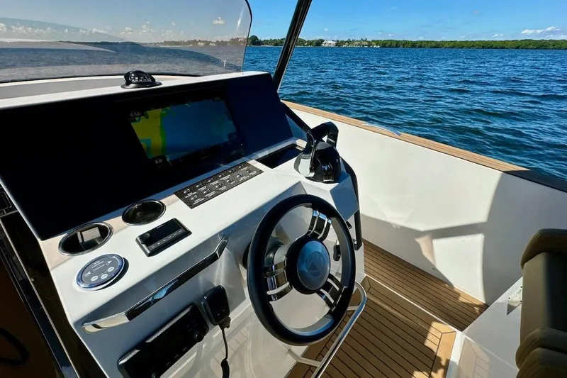  Yacht Photos Pics 2023 Tesoro T38 yacht helm with modern navigation system and ocean view.
