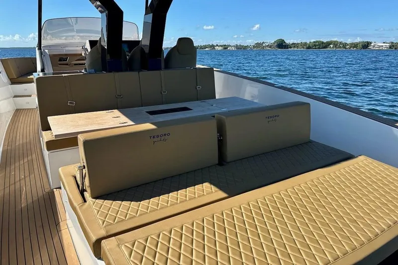  Yacht Photos Pics Luxurious 2023 Tesoro T38 yacht interior with elegant seating and scenic ocean view.