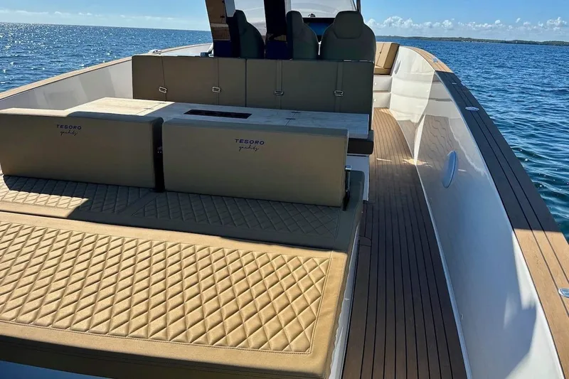  Yacht Photos Pics 2023 Tesoro T38 yacht with luxurious seating on open water.