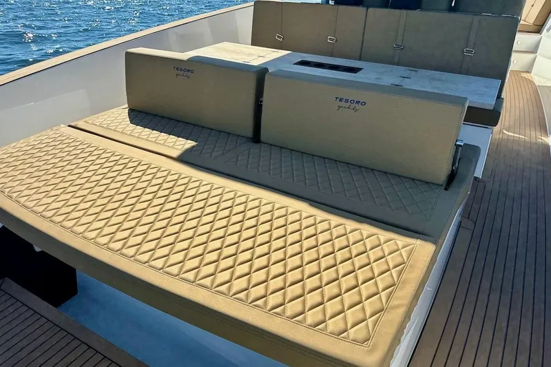  Yacht Photos Pics Luxurious seating on 2023 Tesoro T38 yacht with quilted cushions, ocean view.