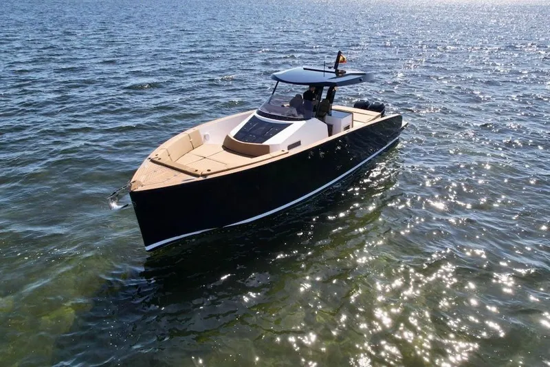  Yacht Photos Pics 2023 Tesoro T38 luxury yacht cruising on sparkling water.