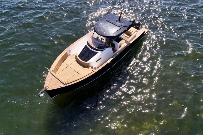  Yacht Photos Pics 2023 Tesoro T38 luxury yacht cruising on sparkling water.