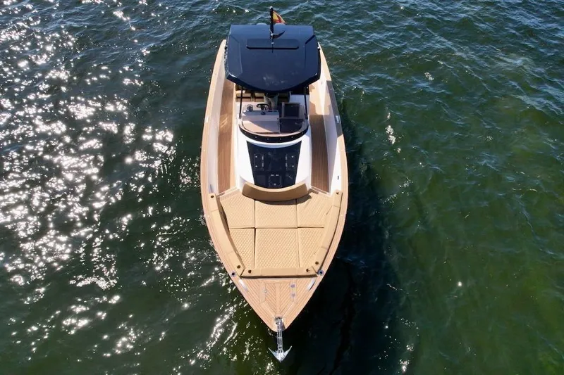  Yacht Photos Pics 2023 Tesoro T38 luxury boat on sparkling water, aerial view.