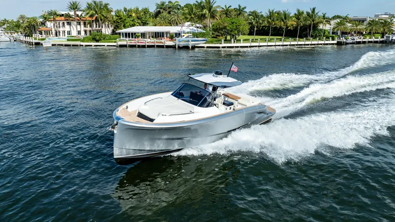  Yacht Photos Pics 2025 Solaris Power 44 Open yacht cruising on a scenic waterway.