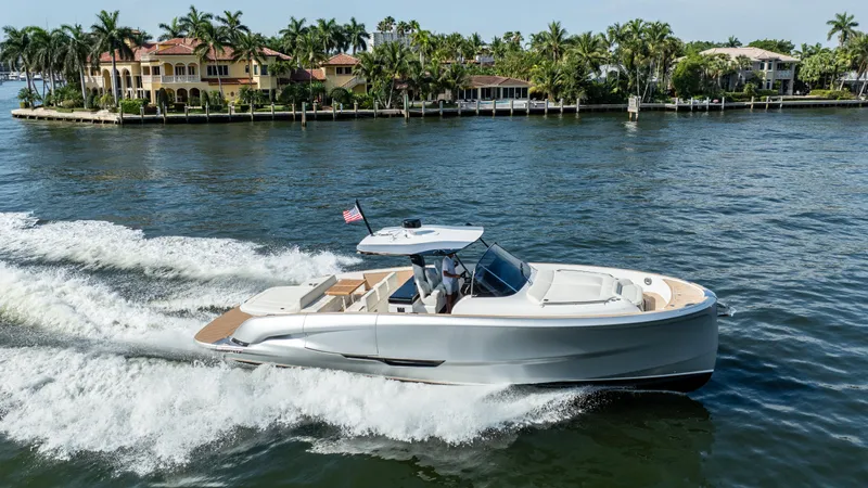  Yacht Photos Pics 2025 Solaris Power 44 Open yacht cruising on a scenic waterway.