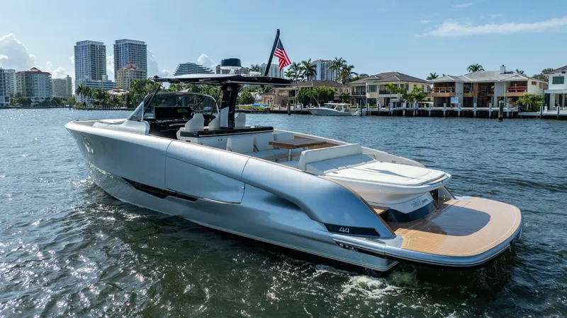  Yacht Photos Pics 2025 Solaris Power 44 Open yacht on water, modern design, city skyline background.