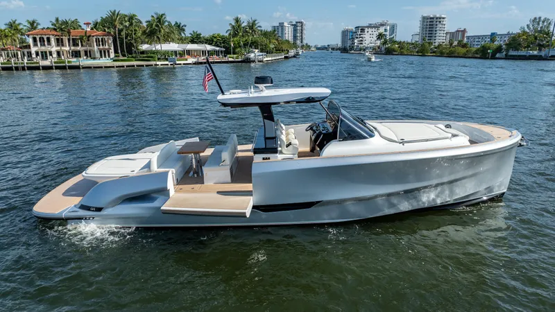  Yacht Photos Pics 2025 Solaris Power 44 Open yacht cruising on a sunny waterway.