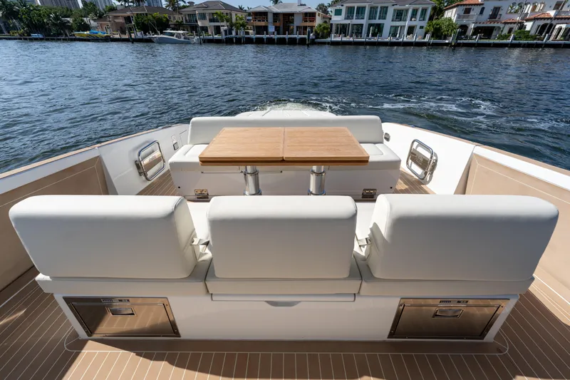  Yacht Photos Pics 2025 Solaris Power 44 Open yacht with elegant seating and table on deck.