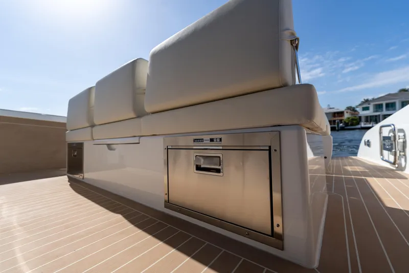  Yacht Photos Pics 2025 Solaris Power 44 Open yacht interior with beige seating and stainless steel storage.