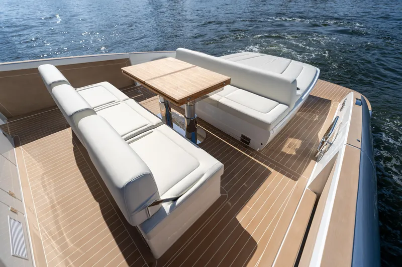  Yacht Photos Pics 2025 Solaris Power 44 Open yacht with elegant seating and table on deck.